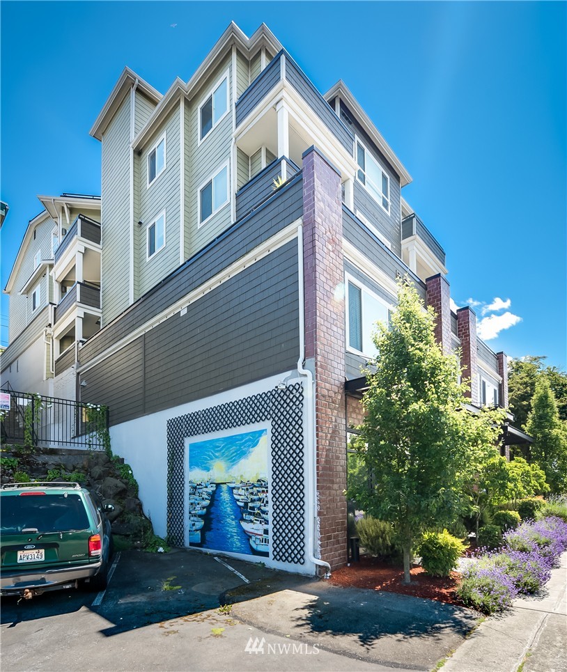 3232 15th Avenue West Seattle, WA 98119 - Photo 3 of 18 a front view of a house with garden