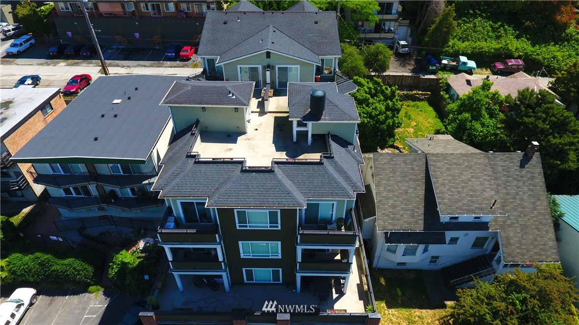 3232 15th Avenue West Seattle, WA 98119 - Photo 9 of 18 an aerial view of house with yard