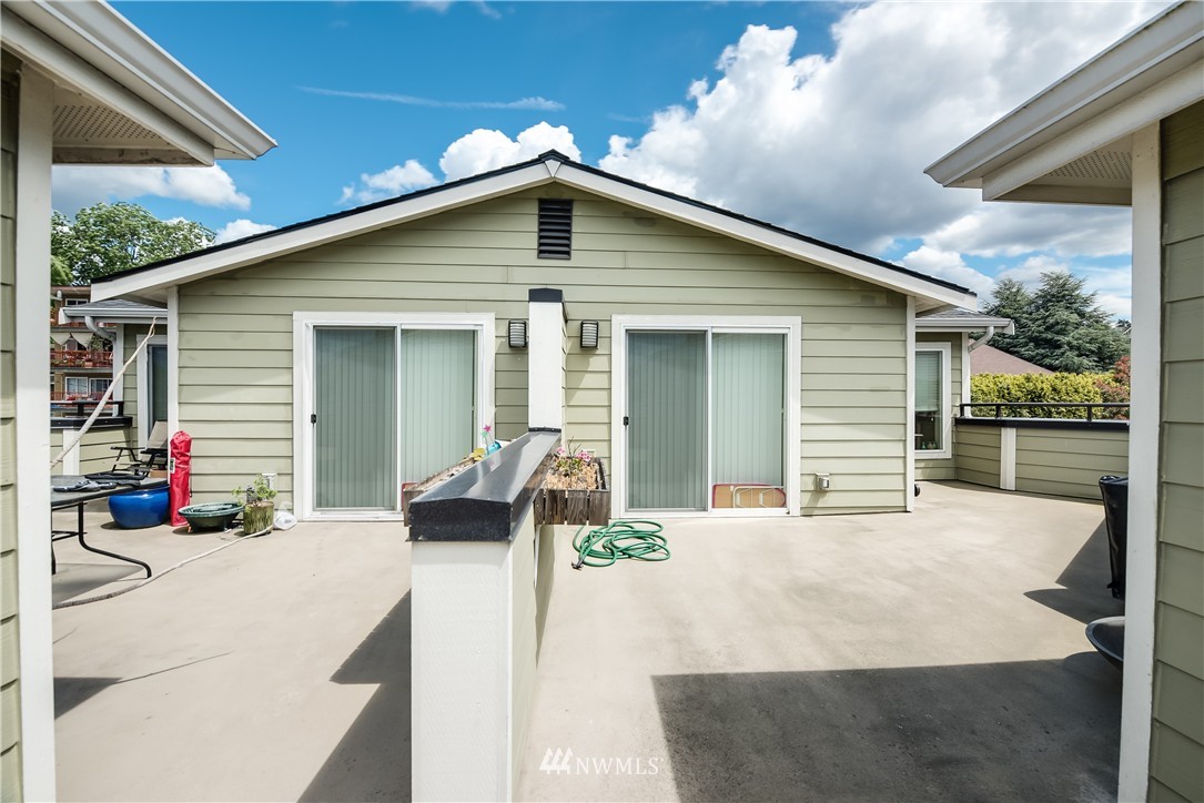 3232 15th Avenue West Seattle, WA 98119 - Photo 10 of 18 a house view with a outdoor space