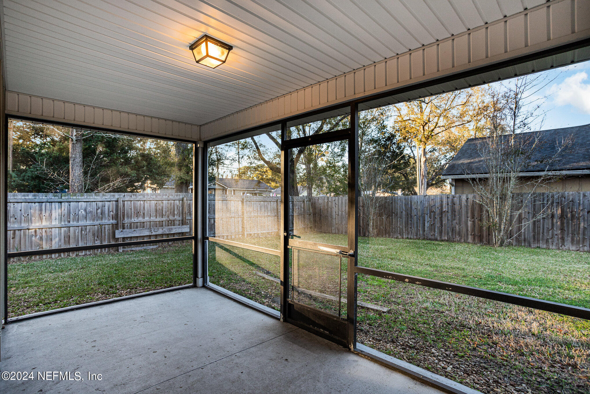 4595 Prunty Avenue Jacksonville, FL 32205 - Photo 14 of 15 a view of backyard with large trees and wooden fence