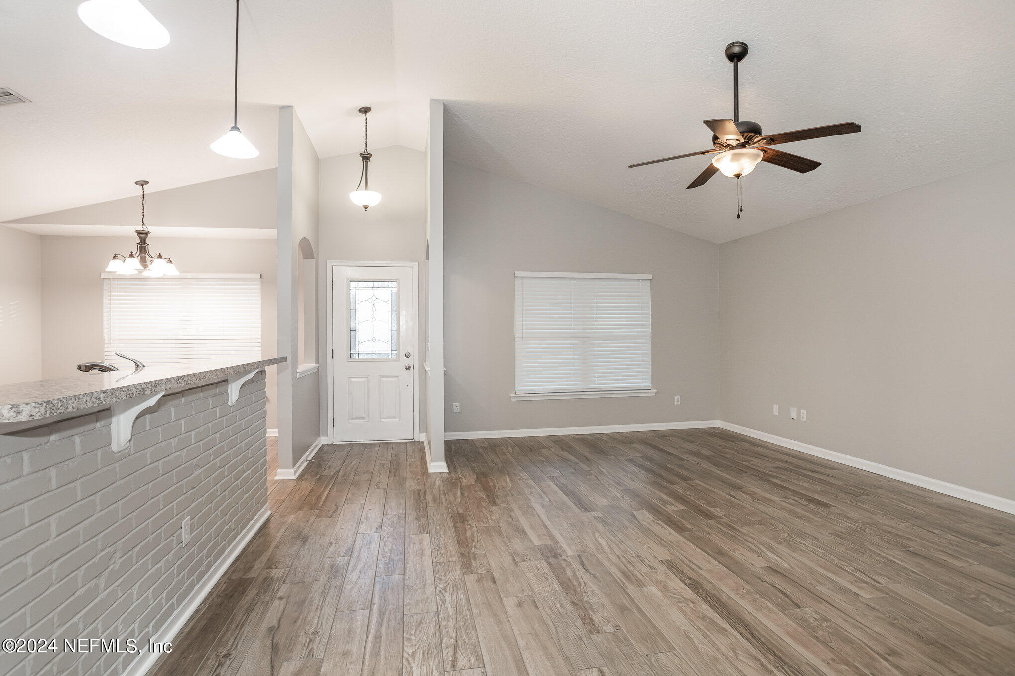 4595 Prunty Avenue Jacksonville, FL 32205 - Photo 4 of 15 a view of an empty room with window and wooden floor