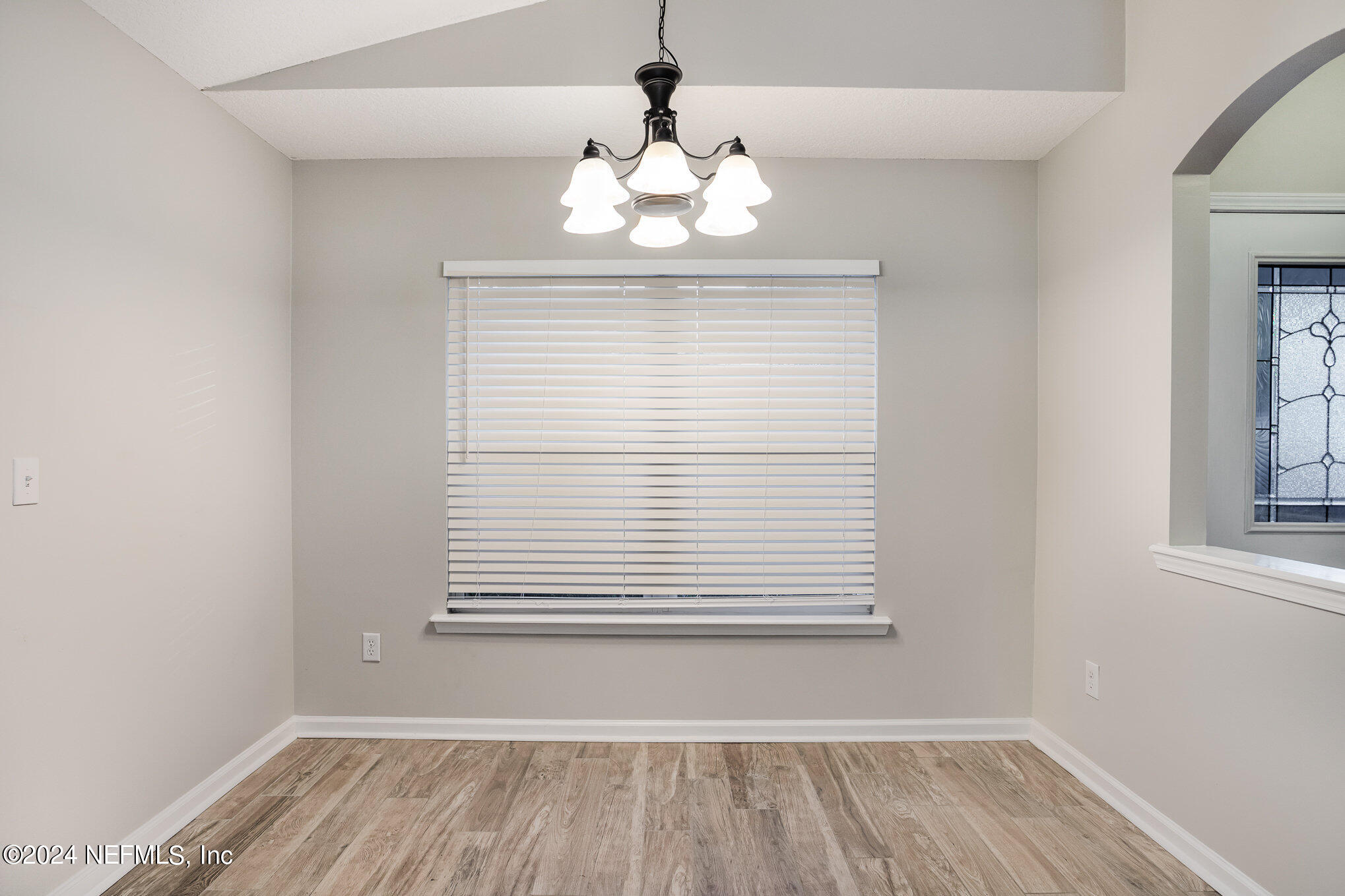4595 Prunty Avenue Jacksonville, FL 32205 - Photo 7 of 15 wooden floor in an empty room with a window