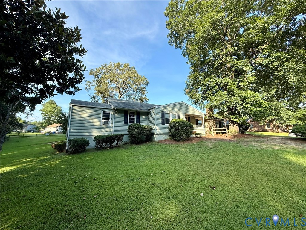 6800 Woodpecker Road Chesterfield, VA 23838 - Photo 1 of 1 a view of a house with a big yard and large trees