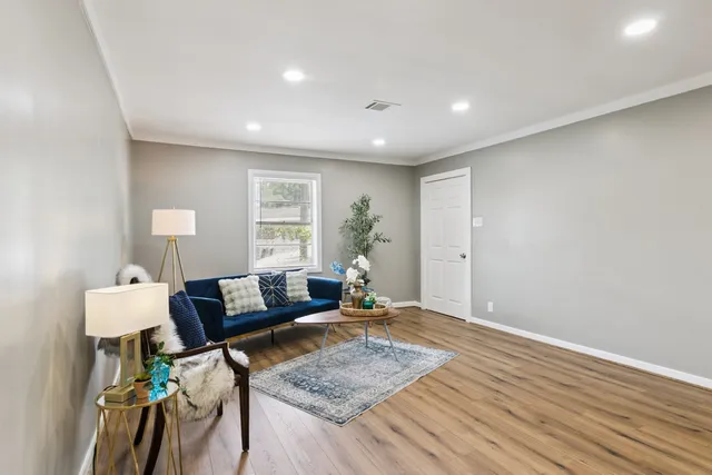 a living room with furniture and a window