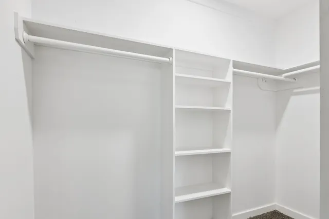a view of an empty walk in closet