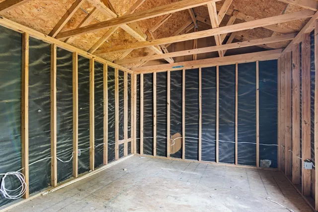 a view of an empty room with windows