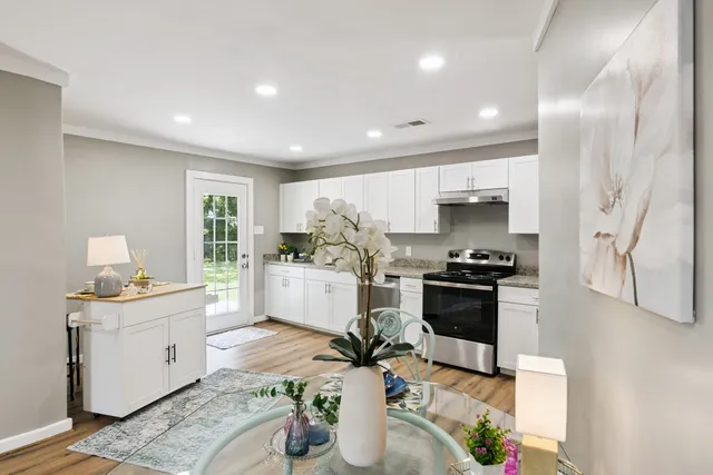 a kitchen with a sink cabinets and stainless steel appliances