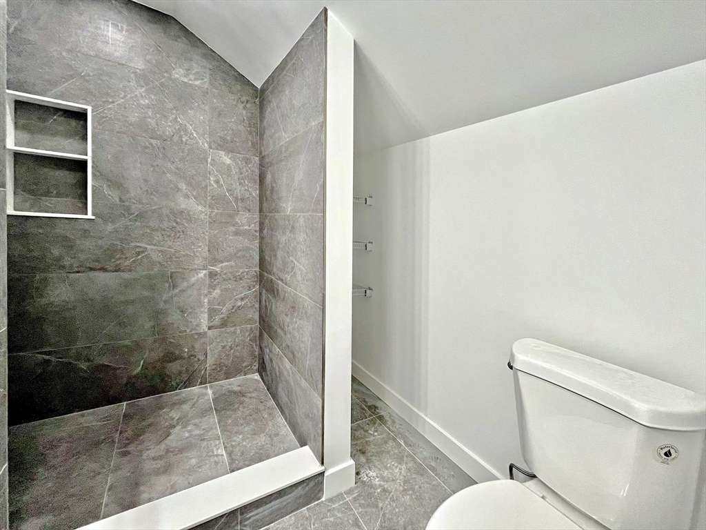 14 Dyer Street, Unit 14 Rockland, MA 02370 - Photo 11 of 16 a bathroom with a toilet and a shower
