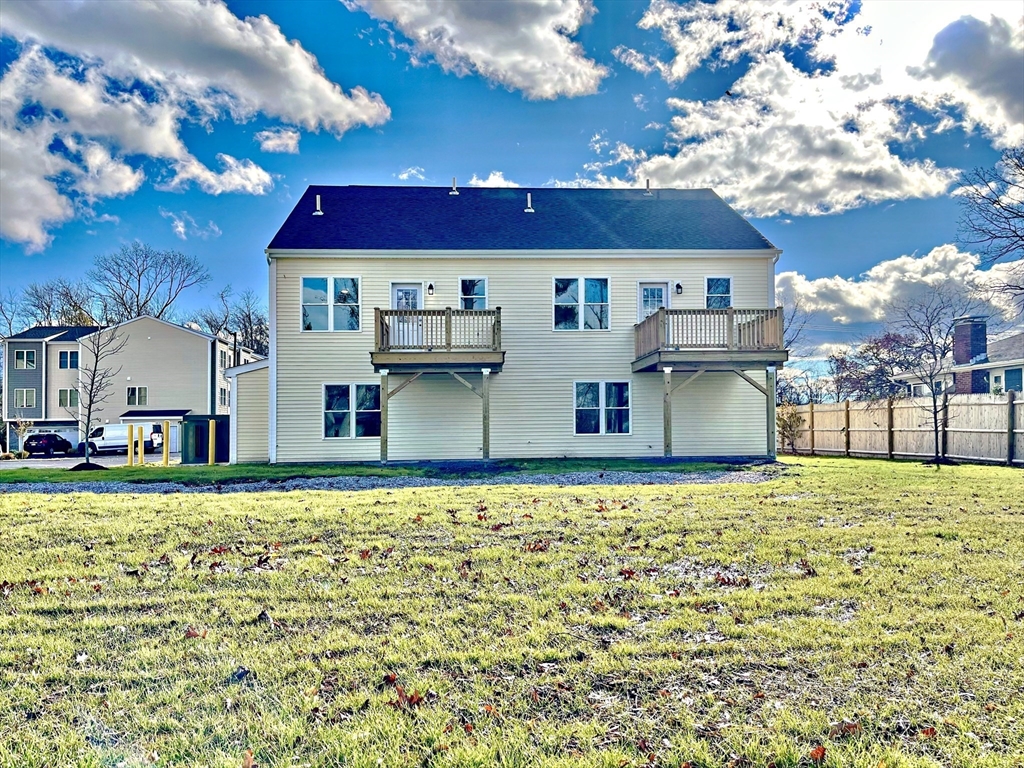14 Dyer Street, Unit 14 Rockland, MA 02370 - Photo 13 of 16 a house with lots of trees in the background