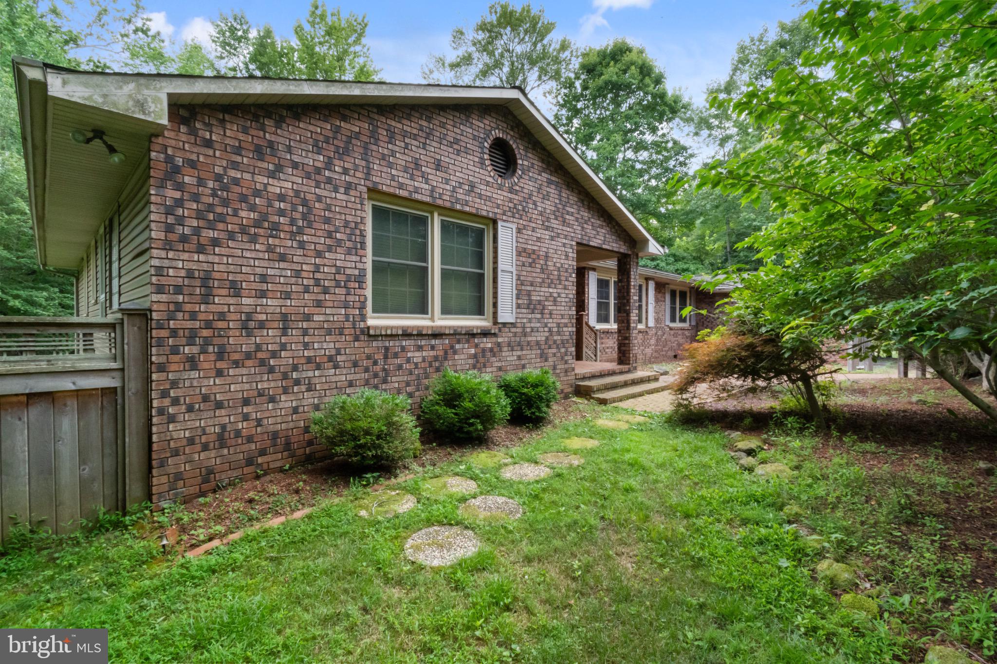 51 Christopher Mill Road Medford, NJ 08055 - Photo 6 of 24 Charming brick home nestled in lush greenery.