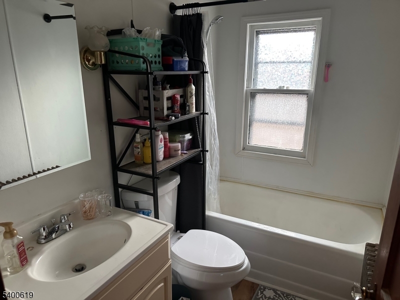 209 Morris Street, Unit 2 Phillipsburg, NJ 08865 - Photo 12 of 12 a bathroom with a toilet sink and bathtub