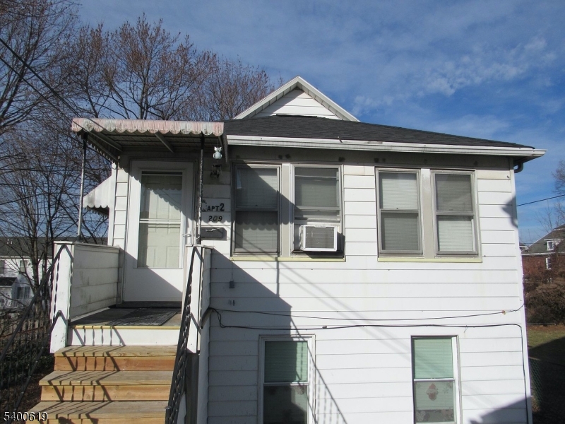 209 Morris Street, Unit 2 Phillipsburg, NJ 08865 - Photo 2 of 12 a front view of a house with garage