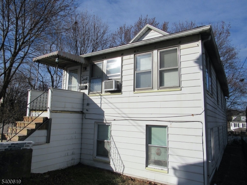 209 Morris Street, Unit 2 Phillipsburg, NJ 08865 - Photo 3 of 12 a view of a white house with large windows