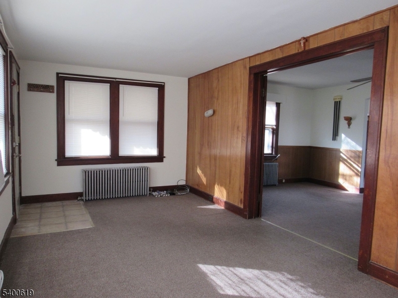209 Morris Street, Unit 2 Phillipsburg, NJ 08865 - Photo 4 of 12 a view of empty room with wooden floor and cabinet
