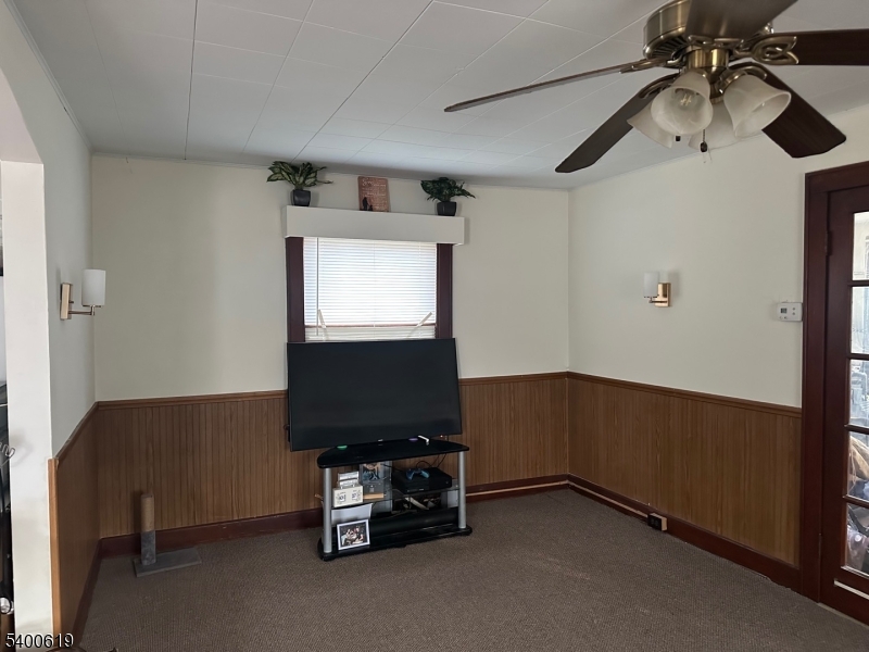 209 Morris Street, Unit 2 Phillipsburg, NJ 08865 - Photo 5 of 12 a room with gym equipment and a flat screen tv