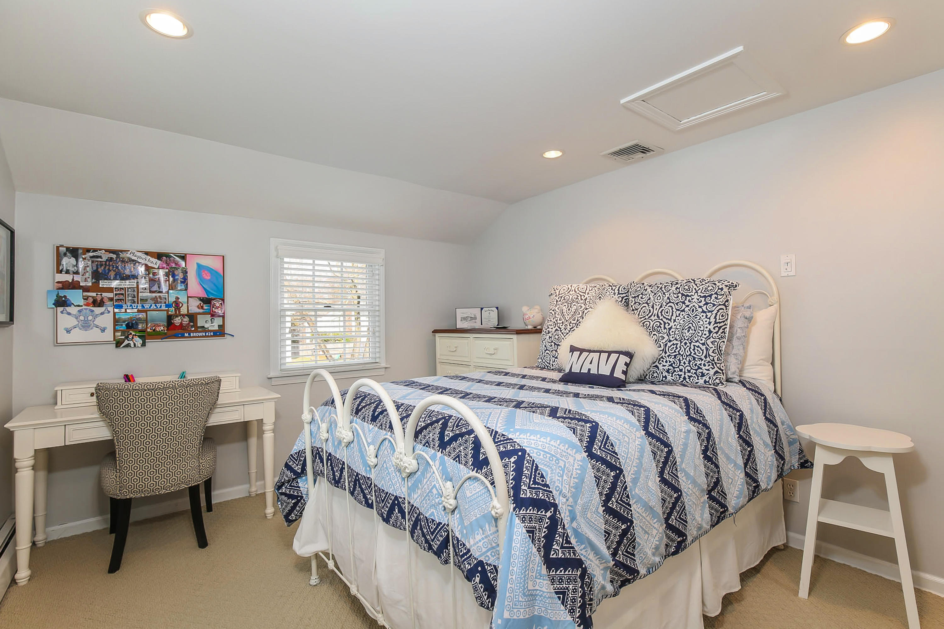 25 Miles Road Darien, CT 06820 - Photo 20 of 30 a bedroom with a bed and a table chair