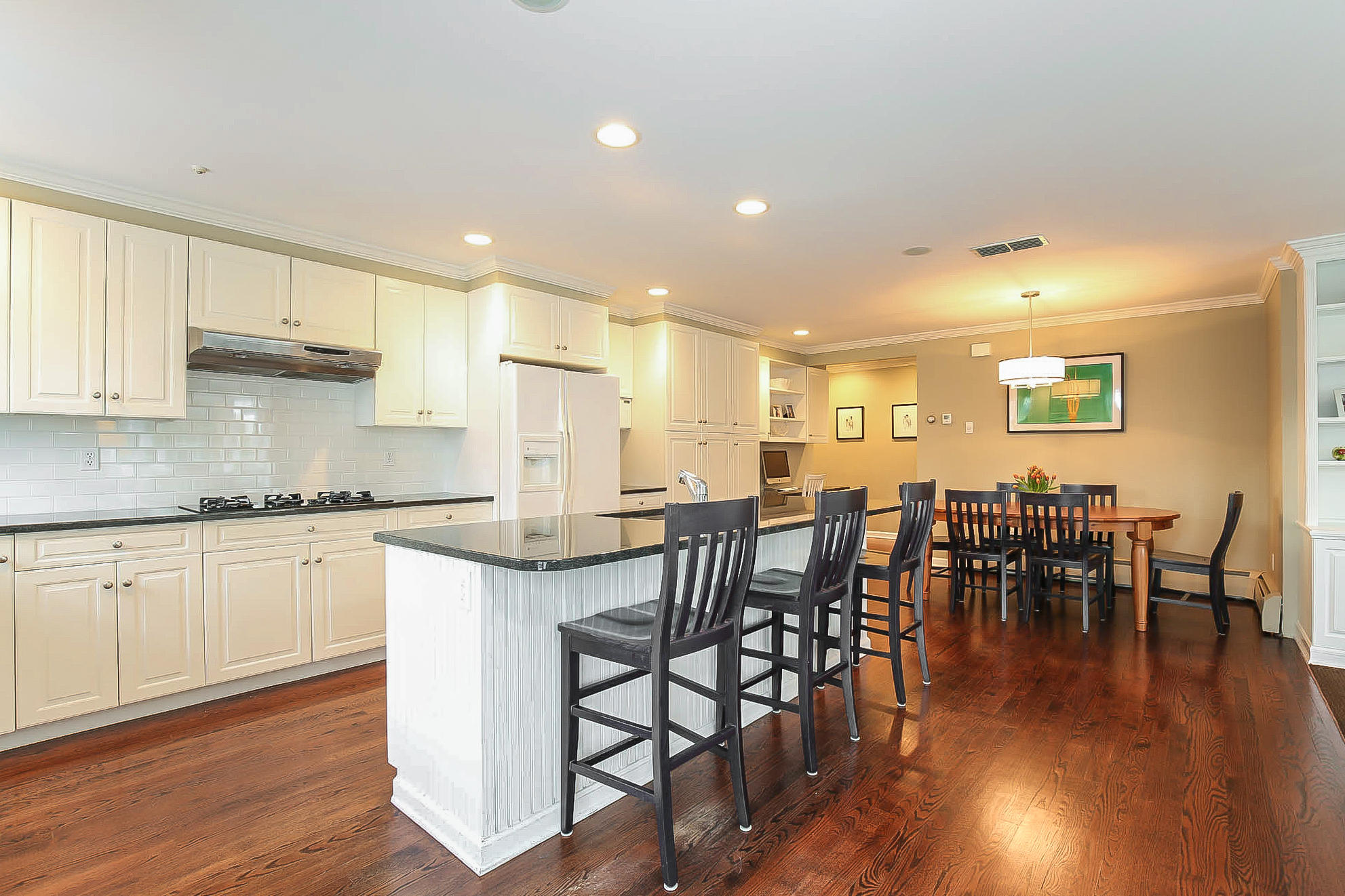 25 Miles Road Darien, CT 06820 - Photo 8 of 30 a kitchen with lots of counter top space and dining table