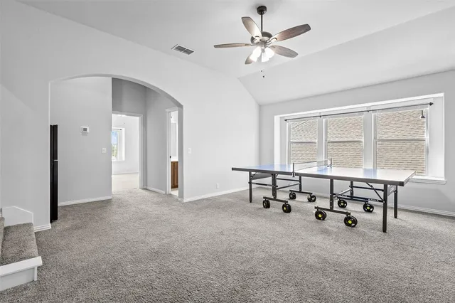 a view of a livingroom with furniture and a window