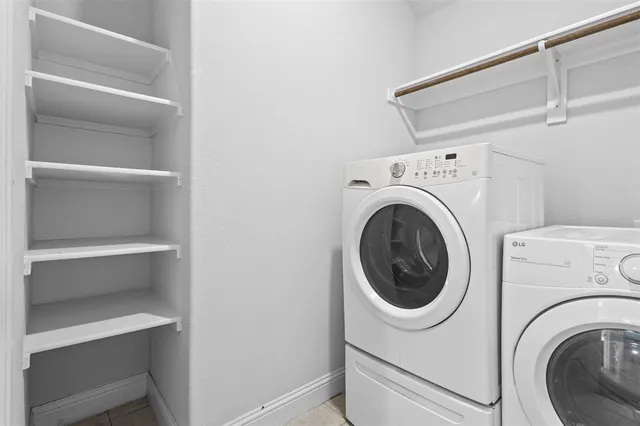 a view of an empty room with a fireplace