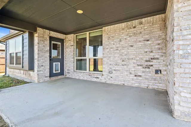 a front view of a house with a swimming pool