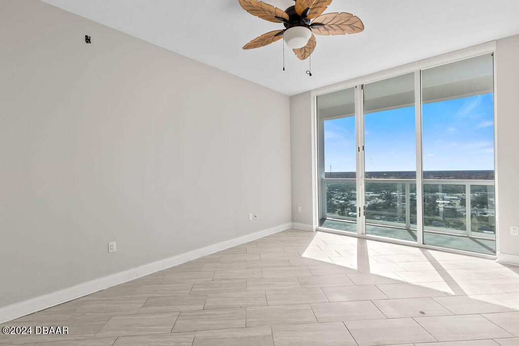 241 Riverside Drive, Unit 2610 Daytona Beach, FL 32117 - Photo 14 of 31 a view of an empty room with a window