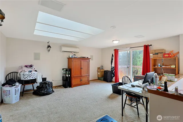 a room with gym equipment and a flat screen tv