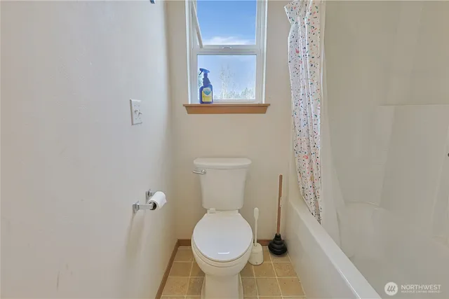 a white toilet sitting next to a small sink