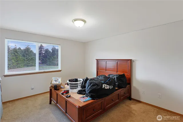 a bed room with furniture and a window