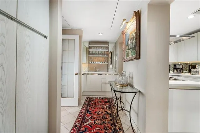 a kitchen with a sink dishwasher stove and cabinets