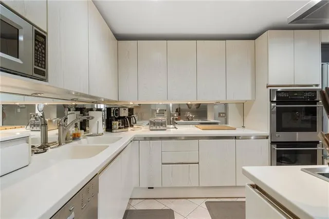 a bathroom with a sink a vanity and mirror