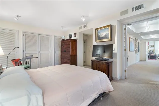 a bed room with a bed and a tv