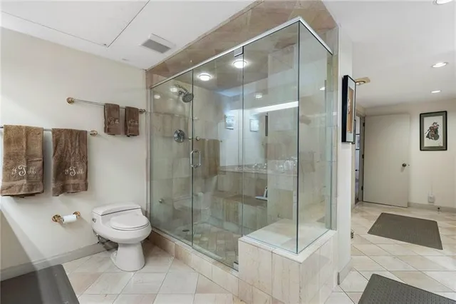 a view of a room with gym equipment and windows