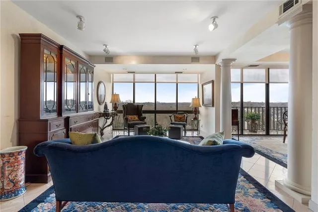 a living room with furniture and a large window