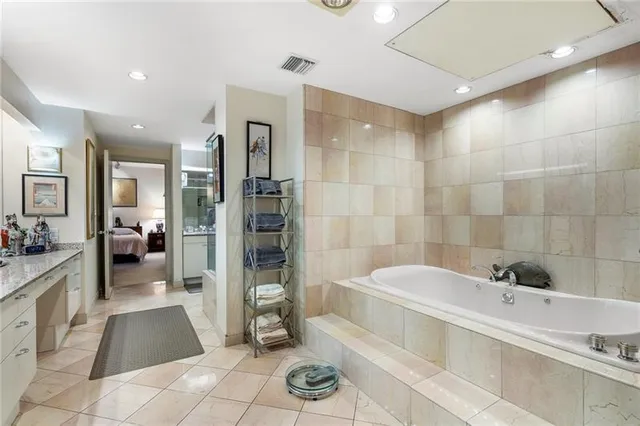 a kitchen with a sink stove top oven and cabinets