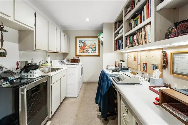 a lobby with furniture and floor to ceiling window