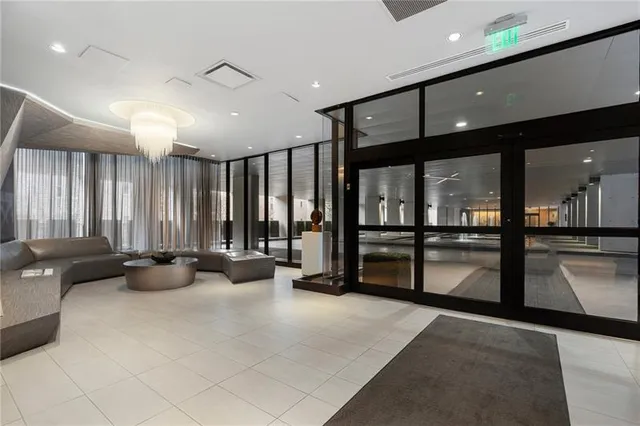 a living room with lots of table and chairs in it