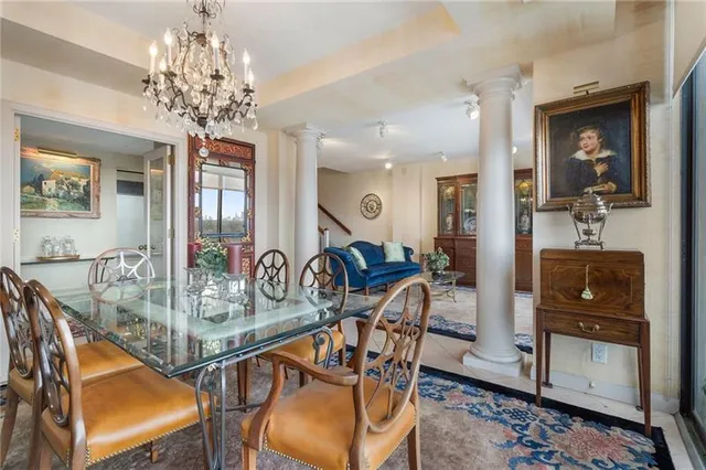 a view of a livingroom with furniture and a window