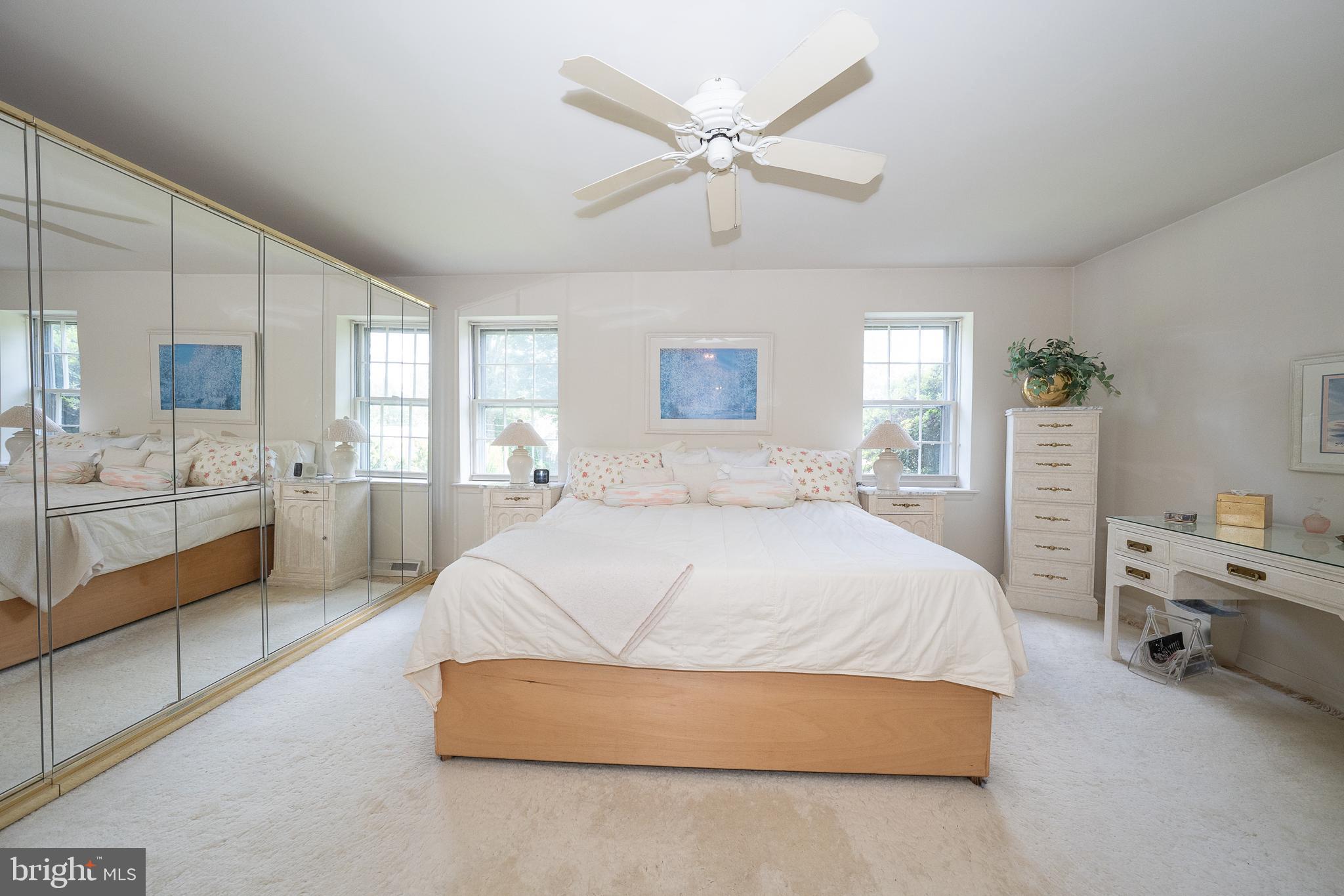 2227 North Stone Ridge Lane Villanova, PA 19085 - Photo 18 of 49 a spacious bedroom with a bed a couch and a large window