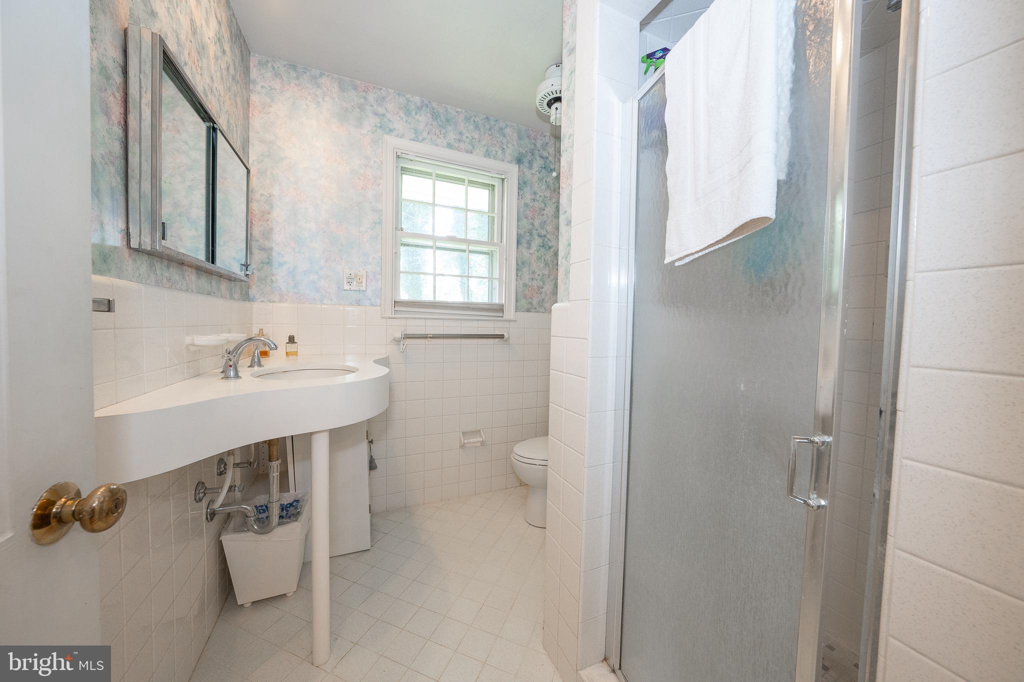 2227 North Stone Ridge Lane Villanova, PA 19085 - Photo 21 of 49 a bathroom with a sink toilet and shower