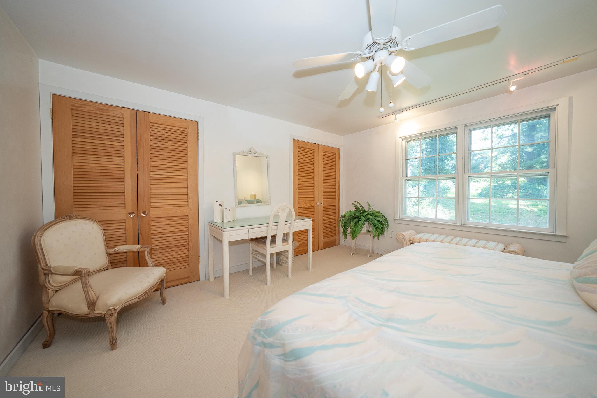 2227 North Stone Ridge Lane Villanova, PA 19085 - Photo 28 of 49 a spacious bedroom with a bed and a chair