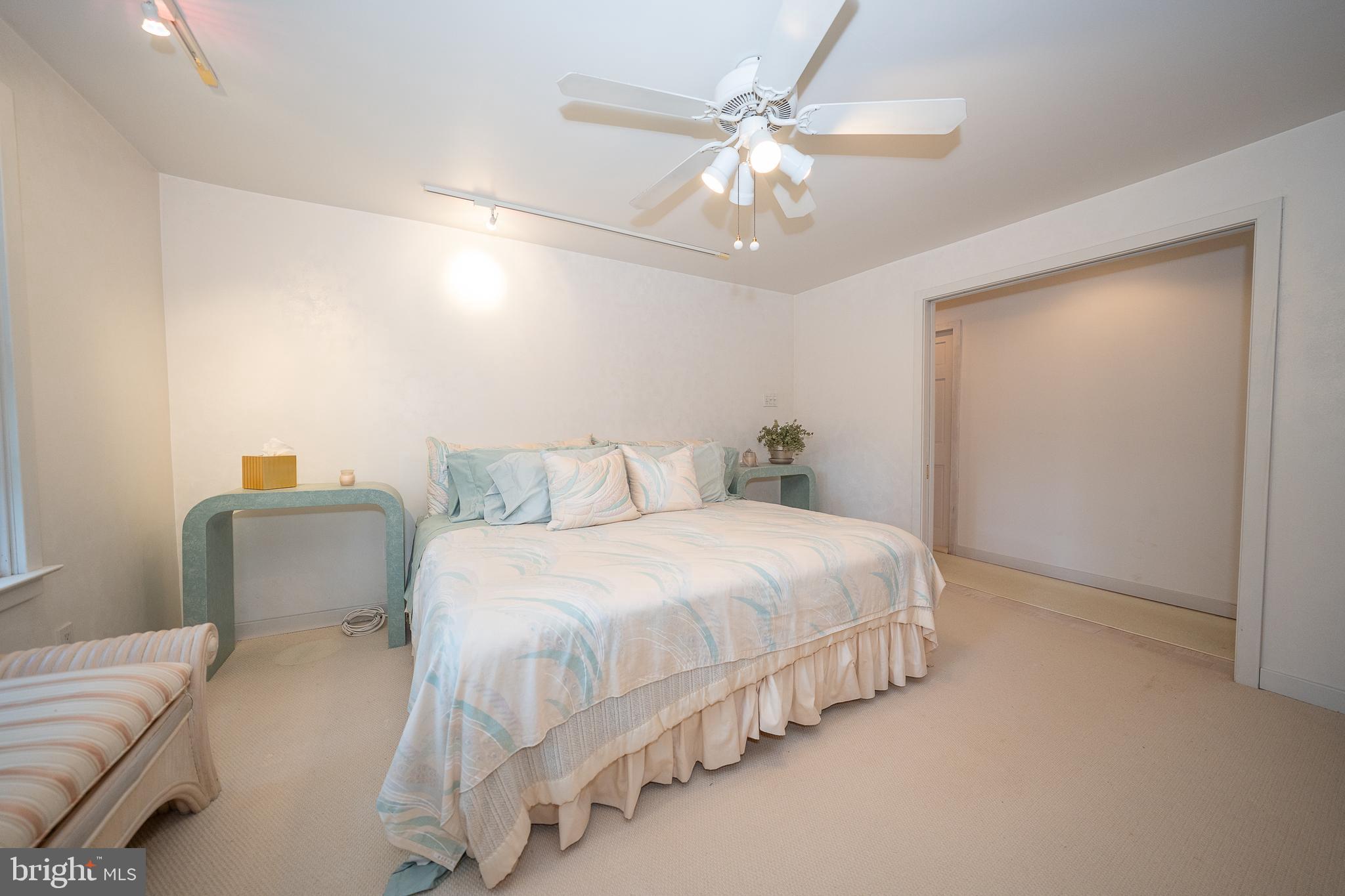 2227 North Stone Ridge Lane Villanova, PA 19085 - Photo 29 of 49 a bedroom with bed and a chandelier
