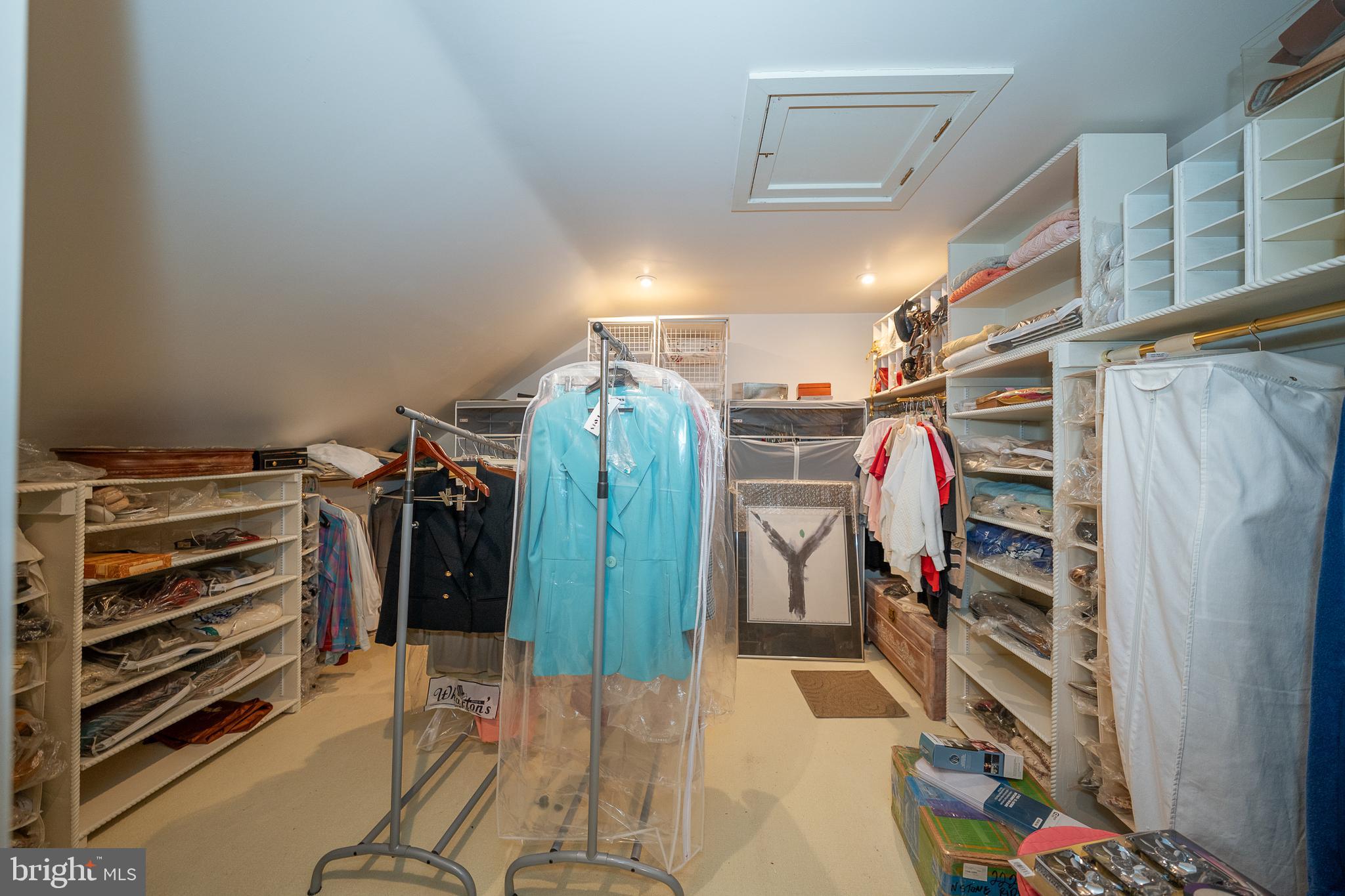 2227 North Stone Ridge Lane Villanova, PA 19085 - Photo 36 of 49 a view of walk in closet with clothes and shoes