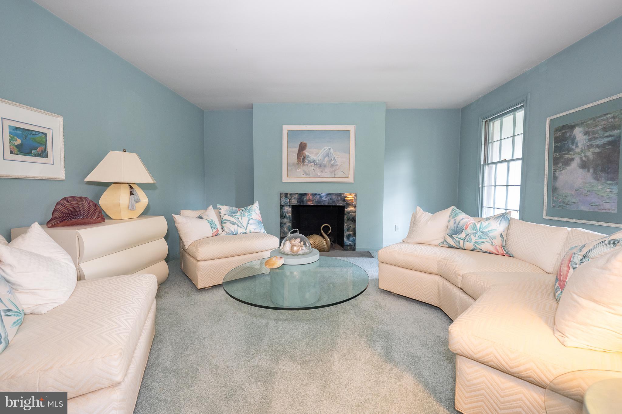 2227 North Stone Ridge Lane Villanova, PA 19085 - Photo 7 of 49 a living room with furniture a lamp and a fireplace