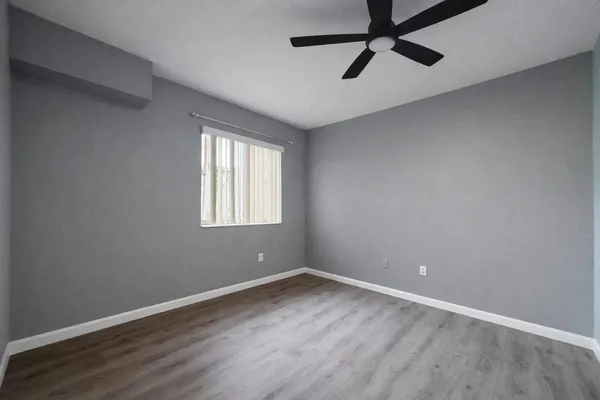 a view of a room with wooden floor