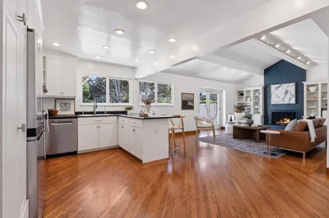 a kitchen with cabinets and stainless steel appliances