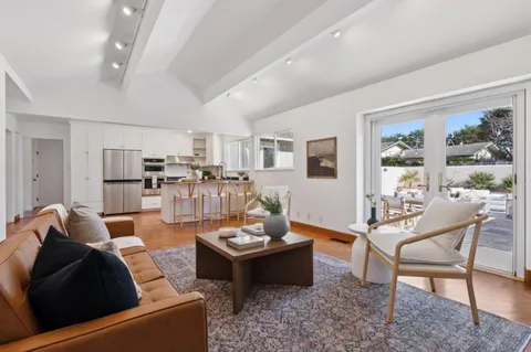 a bedroom with a bed and chair