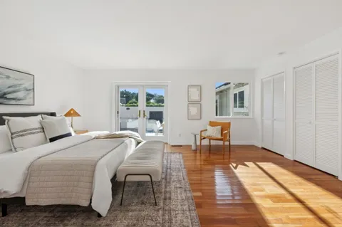 a bathroom with a granite countertop sink mirror and shower