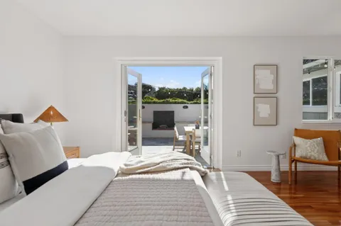 a bathroom with a granite countertop sink and a shower