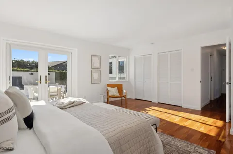 a bedroom with a bed and a table