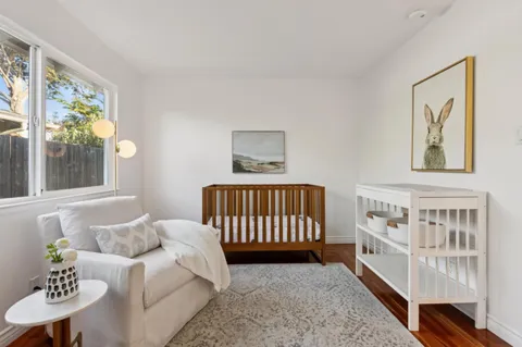 a view of terrace with outdoor seating and covered with tall trees